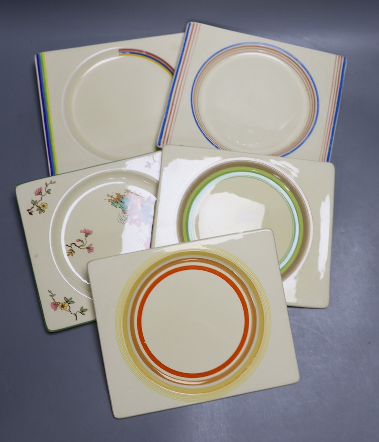 A group of six Clarice Cliff Biarritz plates, various Polly crime geometric designs